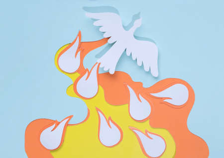 paper silhouette of a white dove depicting the holy spirit and flames with seven gifts