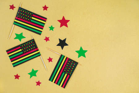 Black Liberation African American flags and stars on yellow background. Black History Month. 19th of july, Juneteenth African American Holiday Celebrating Freedomの写真素材