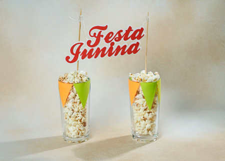 Popcorn on glasses and text Festa Junina, typical Brazilian party food. Holiday event in Juneの写真素材