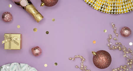 Christmas table setup with champagne, paper fans and Christmas balls. Flat layの写真素材