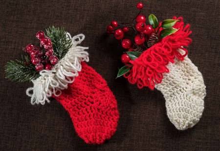christmas knitted sock for gifts on dark background