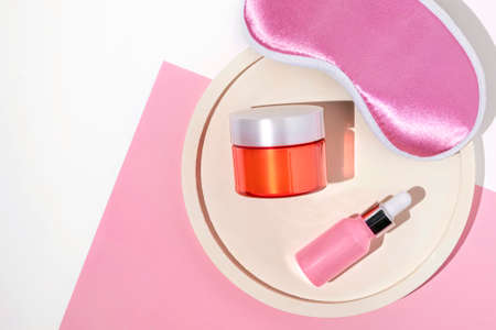 Night face care routine concept. top view sleeping mask, moisturizer cream, serum lotionの写真素材