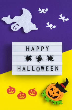 Abstract Halloween composition, background for halloween card, vertical banner. Text Boo,  silhouettes of ghosts and witches on a broomstick. Googly eyesの写真素材