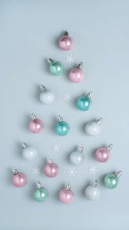 Christmas balls in pastel colors, top view, Christmas composition, vertical format for storiesの写真素材