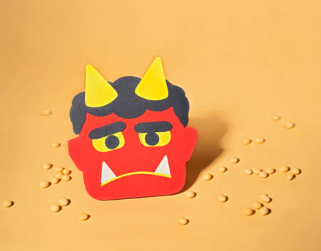 Cute Setsubun paper-craft with Red demon mask  and Lucky beans. Traditional japanese festival, Bean throwing Dayの写真素材