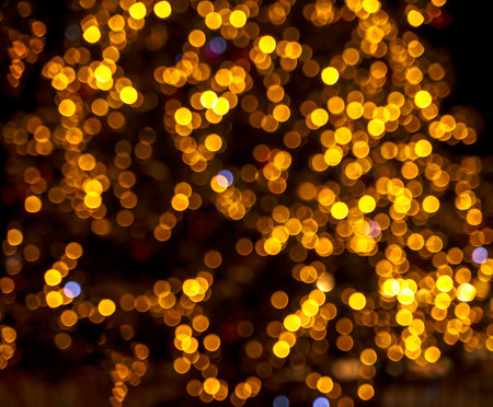 Christmas light garland on dark background. Blurred imageの写真素材