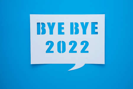 Bye bye 2022 on blue paper background. Hello, Hope and New year time concept