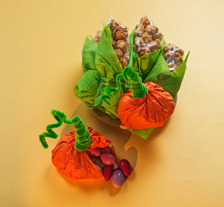 treats for kids packaged in the shape of pumpkin and corn on the cob for Halloween or Kwanzaaの写真素材