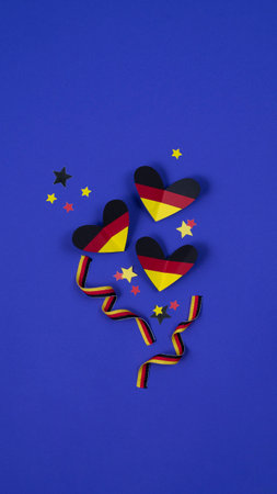 German style abstract background, hearts and ribbon in the colors of the German flagの写真素材