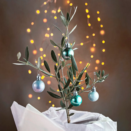 Alternative Christmas tree: Olive tree in a pot decorated with ballsの写真素材