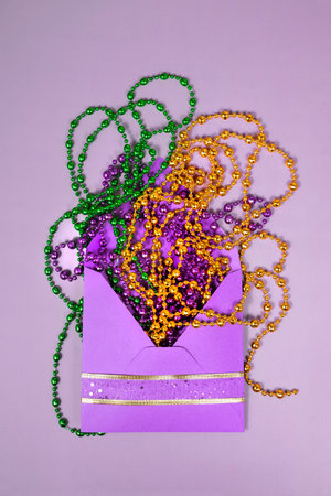 Multi colored mardi gras beads and envelop