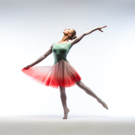 Young beautiful ballerina in a green tutu posing on a studio backgroundの素材