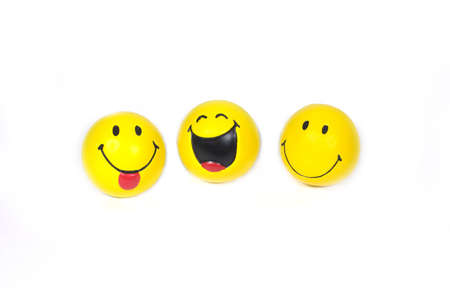 Three funny yellow smiles  isolated on whiteの写真素材