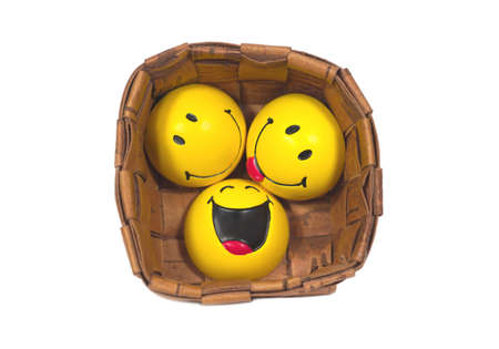 Three funny yellow balls in braided pannierの写真素材