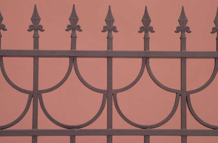 Decorative Sharp bronze fence isolated on brownの写真素材