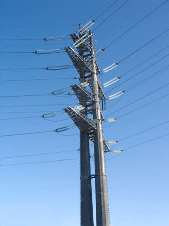 high-voltage power line metal towerの写真素材