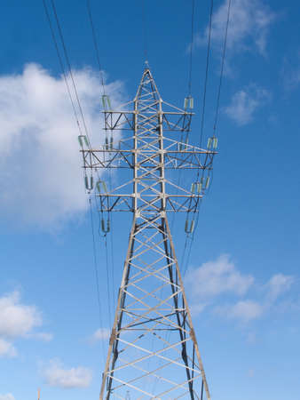 Big high-voltage power line metal tower with many wires vertical view