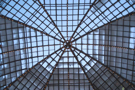 Cupola of retro glass house roof evening inside view