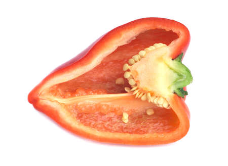 Pepper cut in half isolated on white closeup