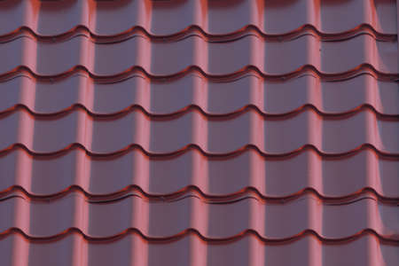 Red house roof as background closeup