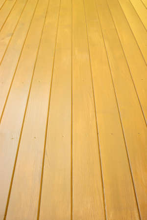 Wooden floor from long, brown boards perspective view verticalの写真素材