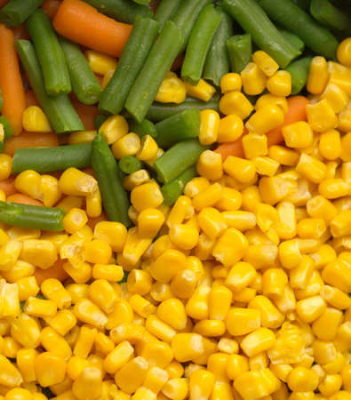 Steamed vegetables  sweet corn, green string beans and carrots closeupの写真素材