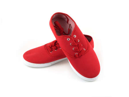 Two funny red shoes isolated on white closeupの写真素材