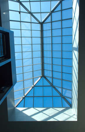 Glass and metal roof of modern building down up view