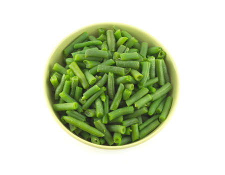Green beans and cauliflower in round bowl isolated on white top view close up