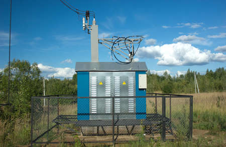 Transformer of rural power supply line in countryside in summer dayの写真素材