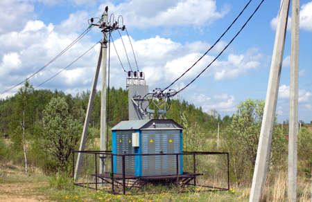 Transformer of rural power supply line in countryside in summer dayの写真素材