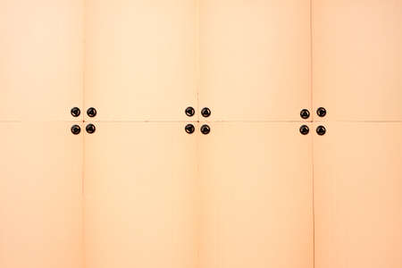 Modern insulation panels are mounted on the wall of a house under construction. Front view closeupの写真素材