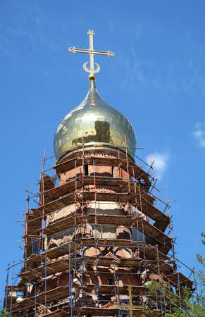 Russian christian church building construction in process. Vertical photo in summer dayの写真素材
