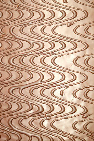 Brown chocolate abstract pattern as background front view vertical closeupの写真素材