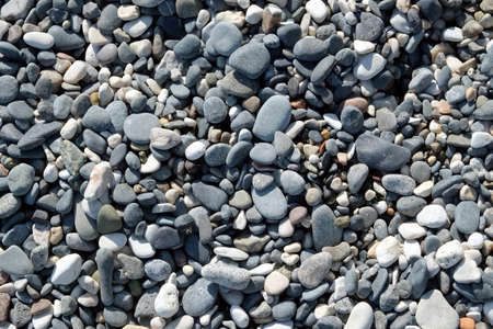 Beach stone pebble as background top view closeupの写真素材
