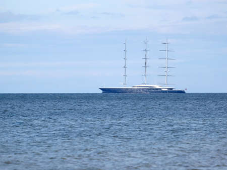 JURMALA, LATVIA - September the 9th, 2019: Luxury Sailing yacht Black Pearl the biggest sailing ship in the world is staying with retracted sails in the open Baltic sea on skyline side view close upのeditorial素材