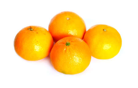 Still life with four ripe appetizing oranges isolated on white background studio shot closeupの写真素材