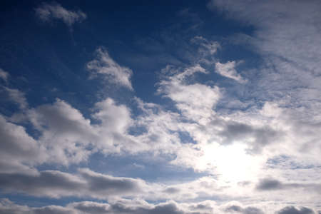 Beautiful celestial landscape with fluffy white clouds high in the stratosphere on a sunny dayの写真素材