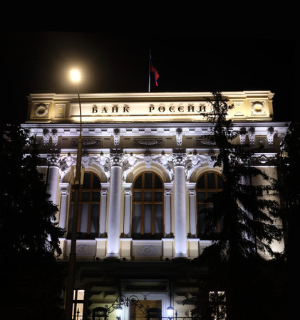 Facade of building of Central Bank of Russia in Moscow with state flag on the top of the building night viewの写真素材