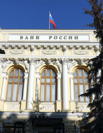 Moscow. Russia - March the 19th 2022: The Central Bank of Russia with the inscription and Russian state flag on the building roofのeditorial素材