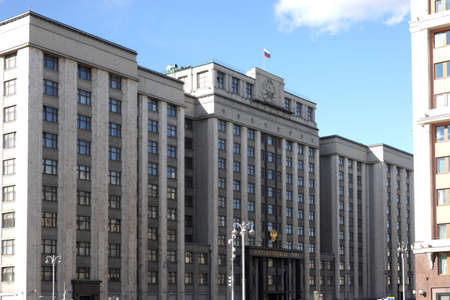 Moscow. Russia - April the 6th 2022: The building of the State Duma of Russia with the inscription State Duma in Russian on the facade on the street Okhotny Ryad in Moscow on a sunny dayのeditorial素材