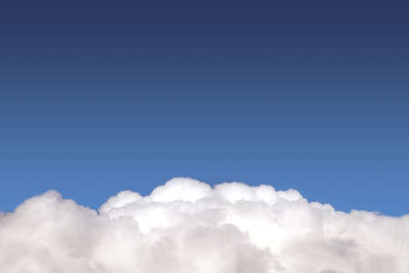 Beautiful panoramic sky landscape with white clouds on the bottom fo photo and gradient blue sky above on bright sunny day horizontal viewの写真素材