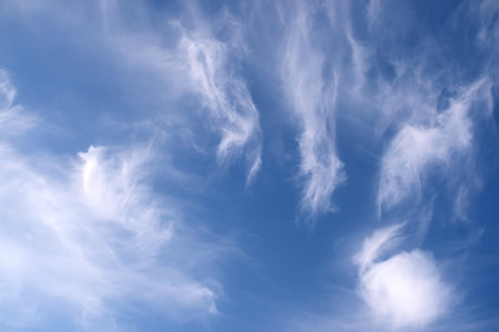 Beautiful sky landscape with white calm fluffy clouds high in the stratosphere on a sunny serenite dayの写真素材