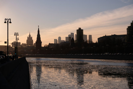 Moskva river, embankment and silhouettes of buildings and towers in soft light at a beautiful sunsetの写真素材