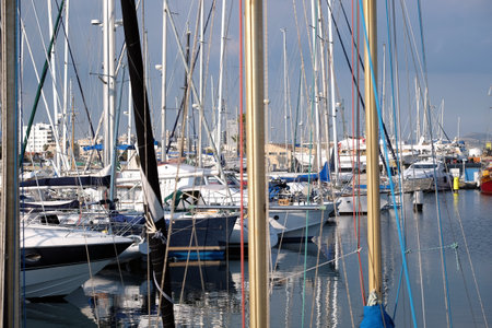 Yachts dense parking in sea marine calm water in Larnaca on bright sunny summer dayの写真素材