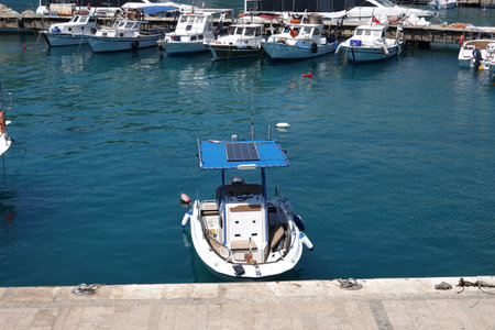 Many motor boats and yachts on parking in sea marine calm water on bright sunny summer dayの写真素材