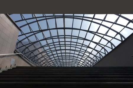 Covered empty pedestrian crossing over the road with a glass roof front viewの写真素材