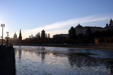 Moskva-river, embankment and silhouettes of buildings and towers in soft light at a beautiful sunsetの写真素材