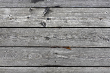 Retro style wooden floor as background from gray boards top view outdoors close-upの写真素材