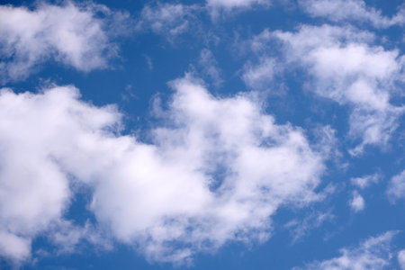 Background from clouds in the sky. Beautiful celestial landscape with white clouds high in the stratosphereの写真素材